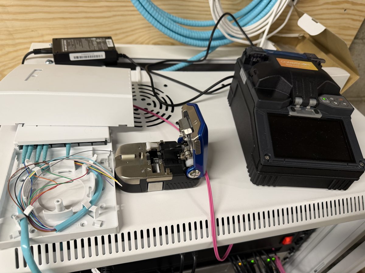 Fusion splicer, cleaver and fiber enclosure on a rack